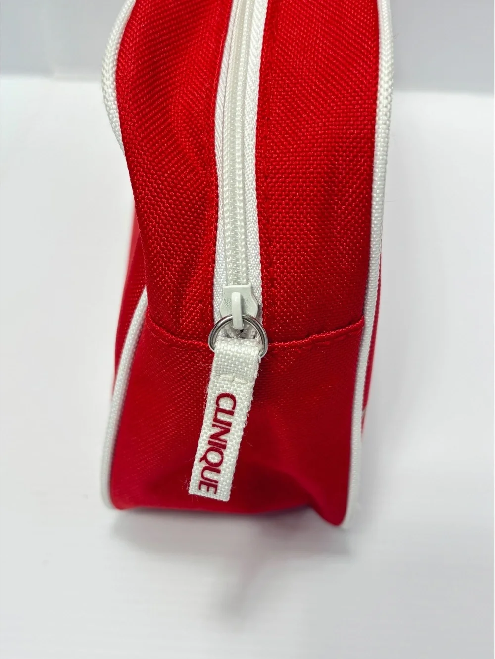 Clinique Red Canvas Cosmetic Bag with White Image Stitching and Zipper Closure